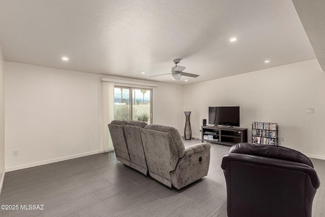 living area featuring baseboards, a ceiling fan, and recessed lighting