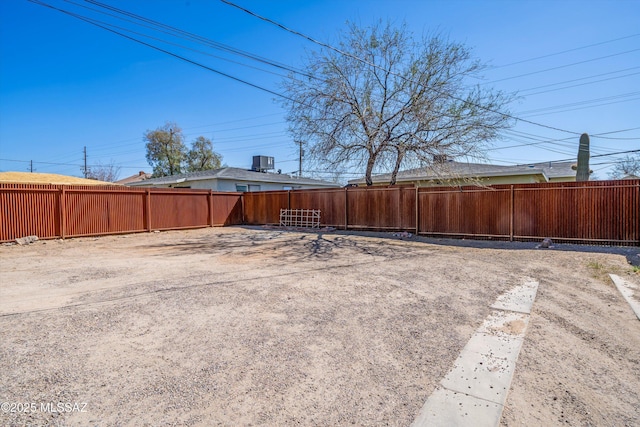 view of yard featuring cooling unit and a fenced backyard