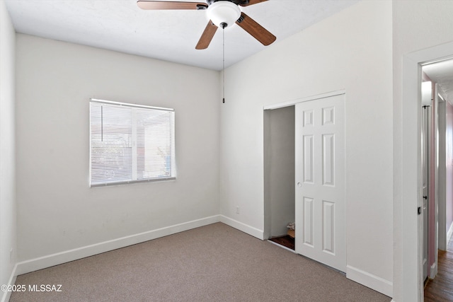 unfurnished bedroom with a closet, baseboards, and carpet