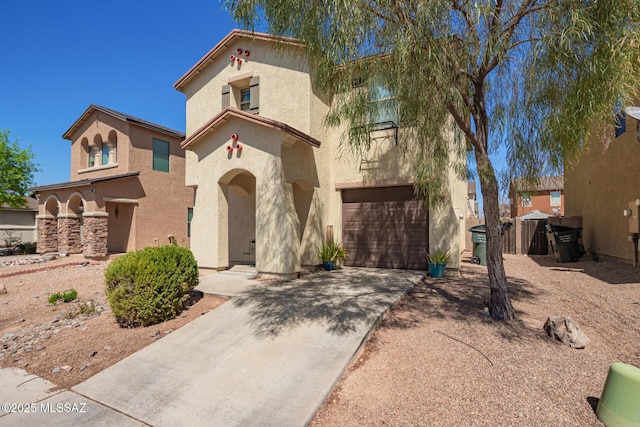 mediterranean / spanish home with driveway, stucco siding, and an attached garage