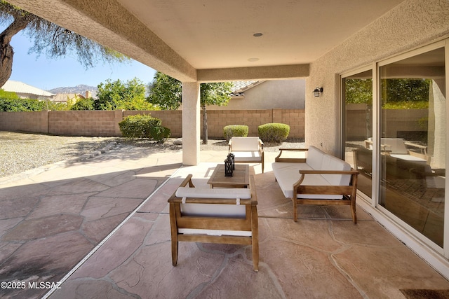 view of patio featuring a fenced backyard and an outdoor living space