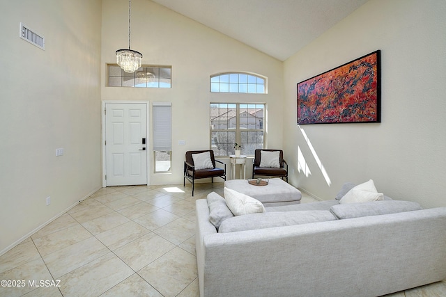 living area featuring high vaulted ceiling, visible vents, an inviting chandelier, and light tile patterned floors