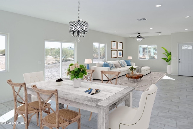 dining space with recessed lighting, visible vents, baseboards, and an inviting chandelier