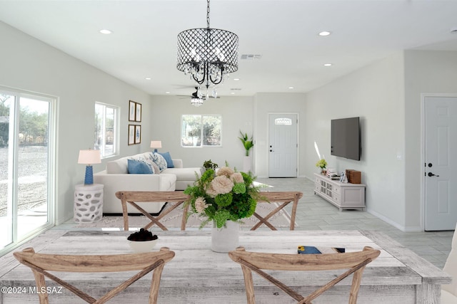 living room featuring a notable chandelier, baseboards, visible vents, and recessed lighting