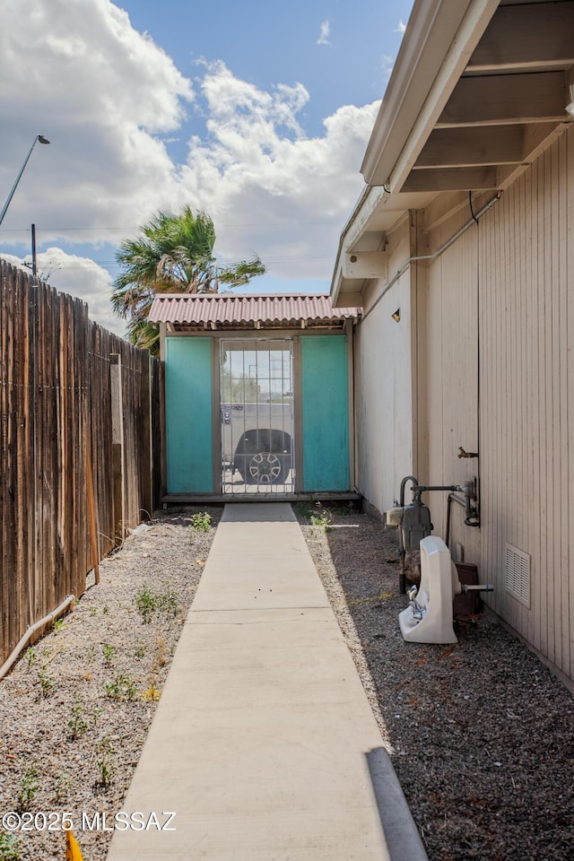 view of patio featuring visible vents and fence