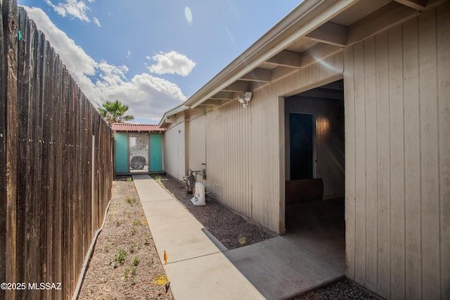 view of home's exterior with fence