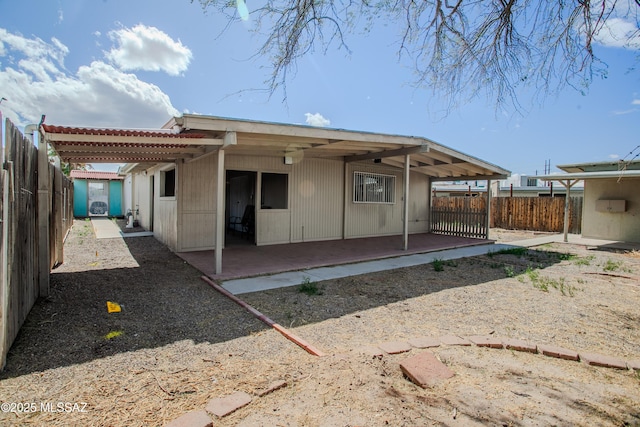 back of house with a patio and a fenced backyard