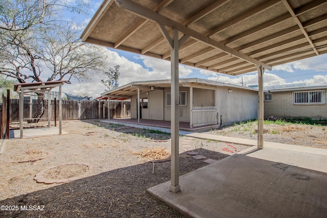 view of patio featuring fence