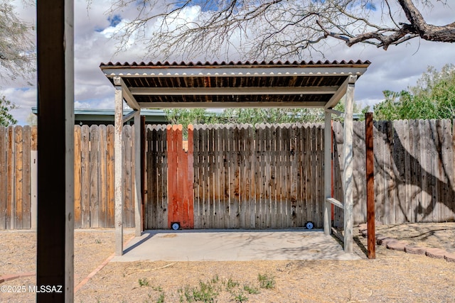 view of gate featuring fence