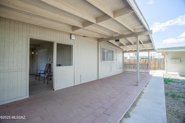 view of patio / terrace featuring fence