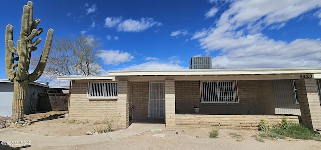 view of front of property featuring brick siding