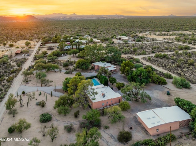 drone / aerial view with view of desert and a mountain view