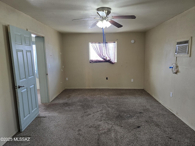 carpeted empty room featuring ceiling fan and a wall mounted air conditioner