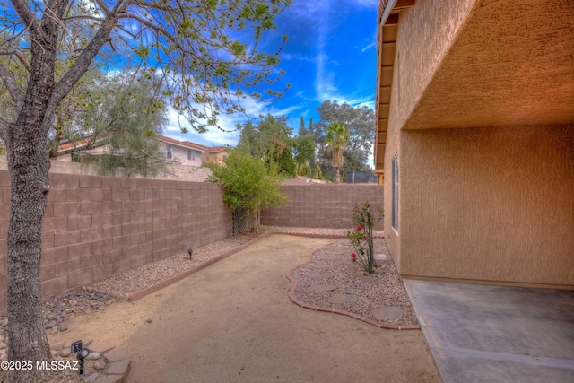 view of yard featuring a fenced backyard and a patio