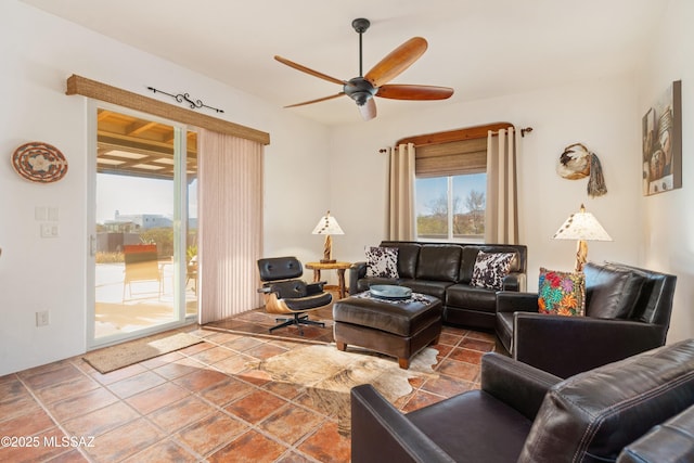 tiled living area featuring ceiling fan