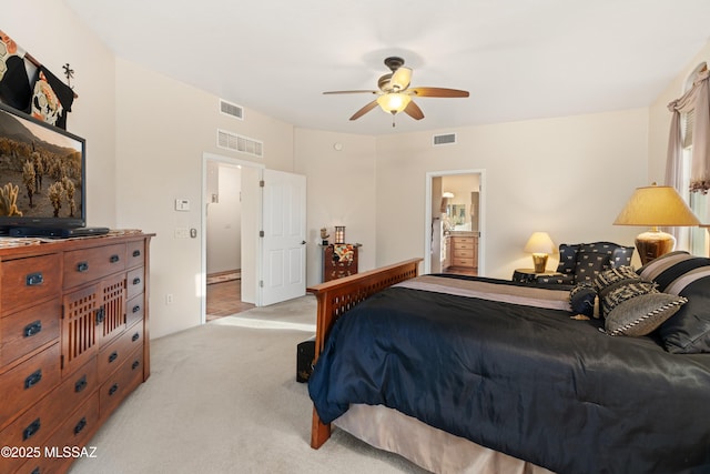 bedroom with visible vents, light carpet, and ceiling fan