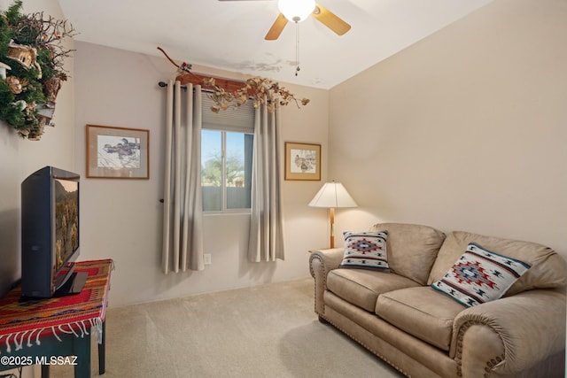 carpeted living room featuring ceiling fan