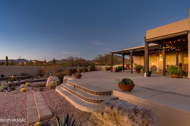 view of patio featuring fence