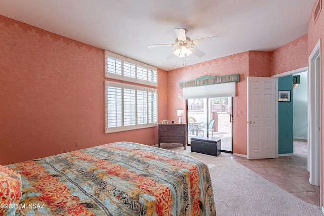 carpeted bedroom featuring baseboards, a ceiling fan, and tile patterned floors