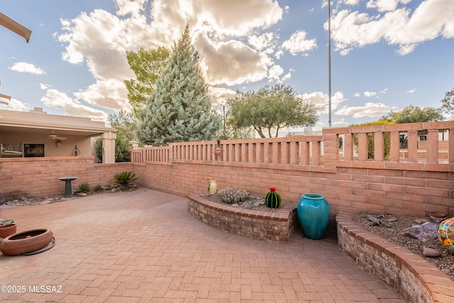 view of patio featuring fence