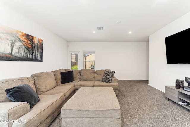 living area featuring carpet floors, visible vents, and recessed lighting