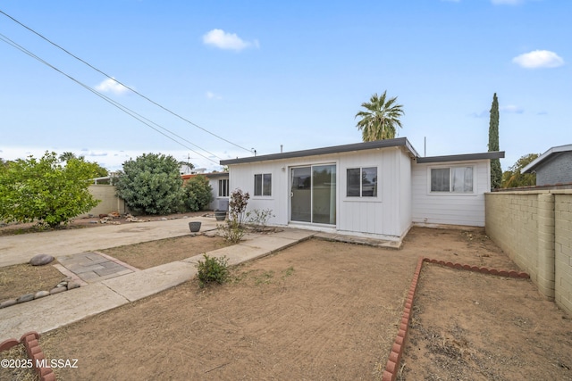 back of property with fence