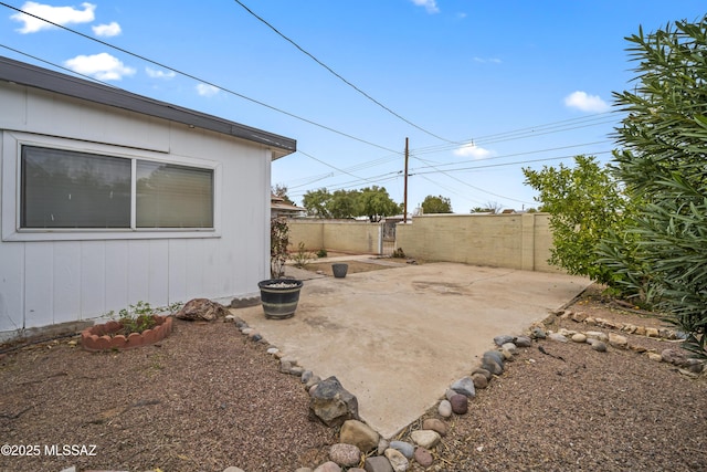 view of patio featuring fence