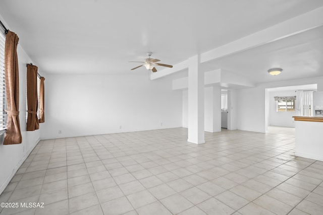 unfurnished living room with light tile patterned floors and ceiling fan