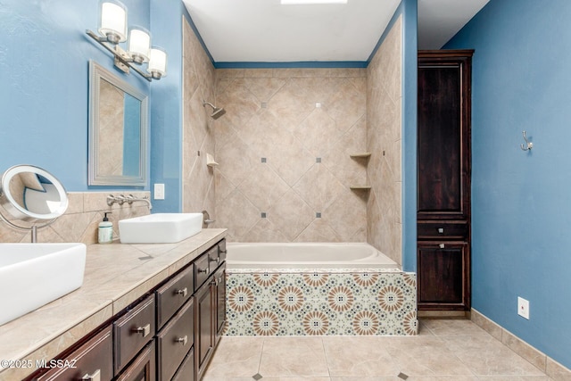 full bath with tiled shower / bath, double vanity, tile patterned flooring, and a sink