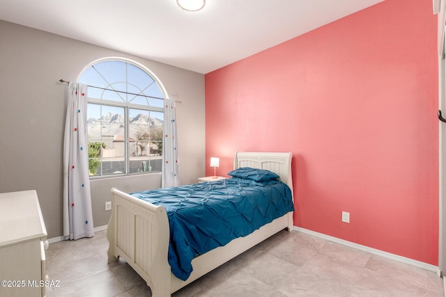 bedroom featuring baseboards