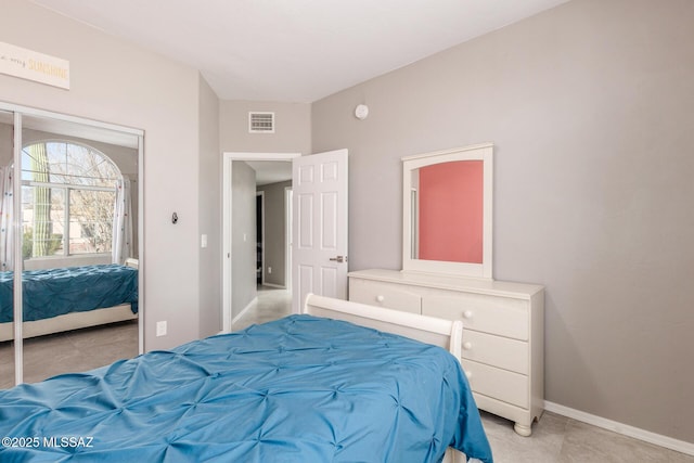 bedroom with visible vents and baseboards