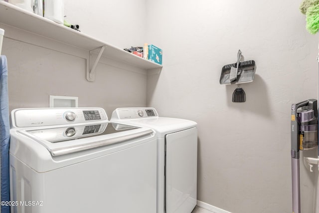 laundry room featuring laundry area and separate washer and dryer