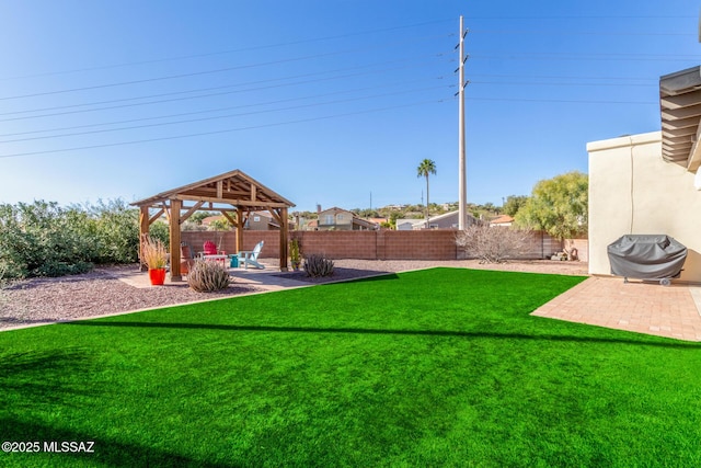 view of yard with a fenced backyard, a patio, and a gazebo