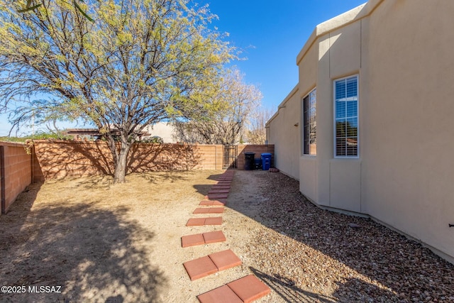 view of yard with a fenced backyard