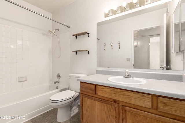 full bath featuring toilet, tile patterned floors, bathing tub / shower combination, and vanity