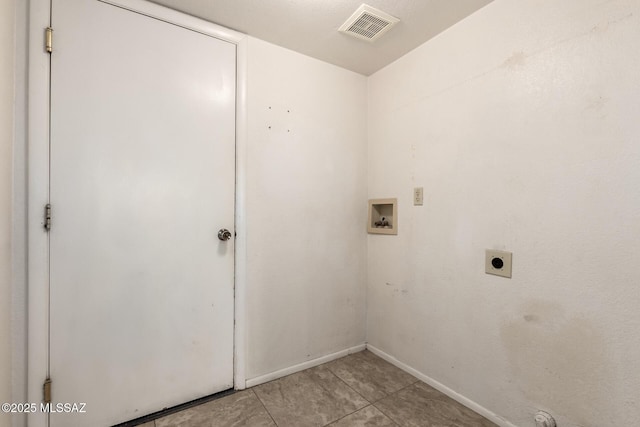 clothes washing area featuring laundry area, baseboards, visible vents, hookup for a washing machine, and hookup for an electric dryer