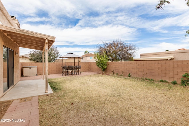 view of yard with a patio area and a fenced backyard