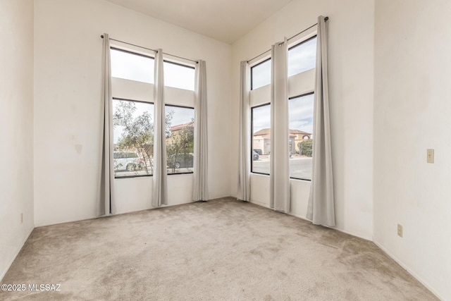 spare room featuring carpet floors