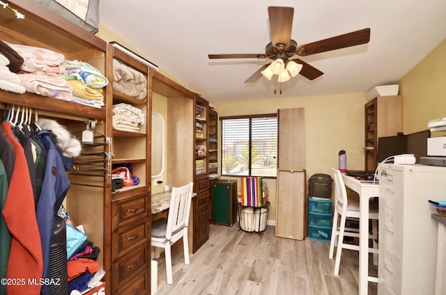 interior space featuring ceiling fan