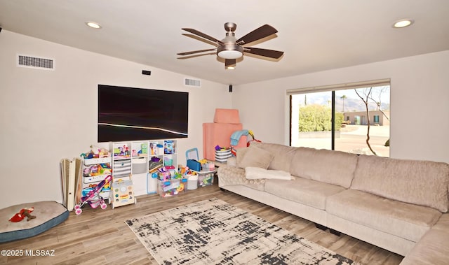 living area featuring recessed lighting, visible vents, ceiling fan, and wood finished floors