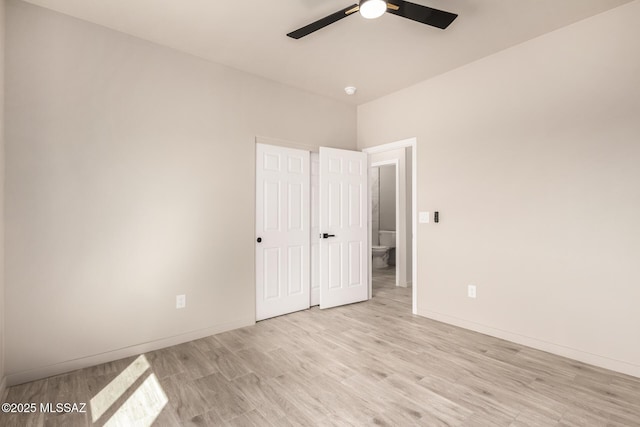 unfurnished bedroom with light wood-style floors, baseboards, and a ceiling fan