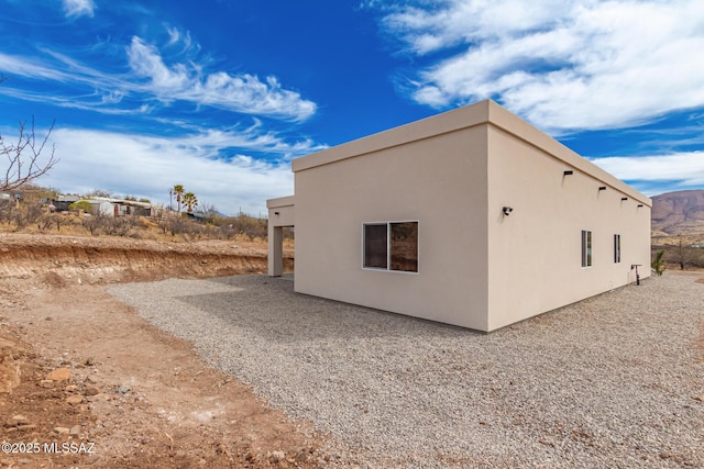 view of property exterior featuring a patio area and stucco siding