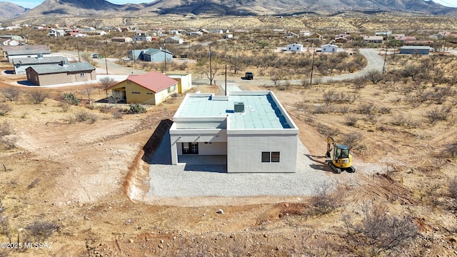 birds eye view of property featuring a mountain view