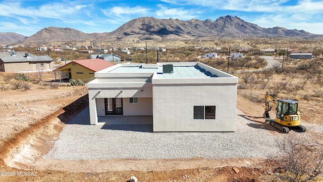 view of storm shelter with a mountain view