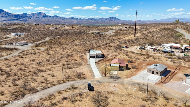 aerial view featuring a mountain view and view of desert
