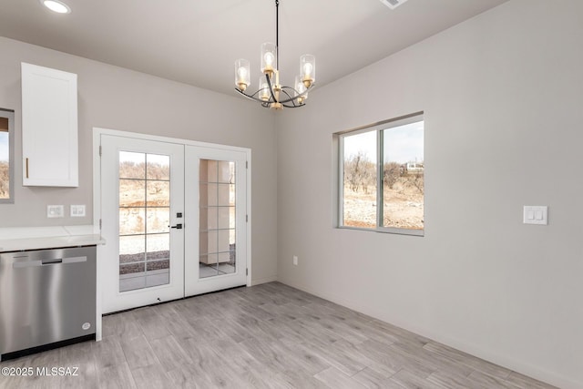 doorway with light wood-style flooring, recessed lighting, baseboards, french doors, and an inviting chandelier
