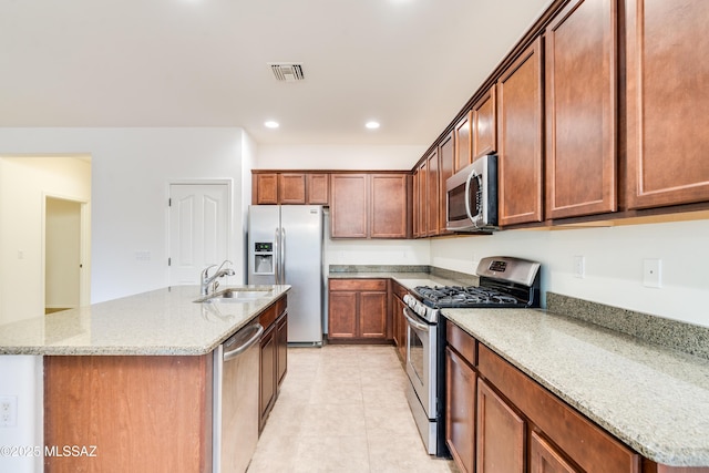 1091 E Empire Canyon Ln, Sahuarita, AZ 85629 - kitchen with recessed lighting, visible vents, appliances with stainless steel finishes, a sink, and light stone countertops