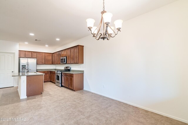 1091 E Empire Canyon Ln, Sahuarita, AZ 85629 - kitchen featuring visible vents, hanging light fixtures, appliances with stainless steel finishes, a sink, and baseboards