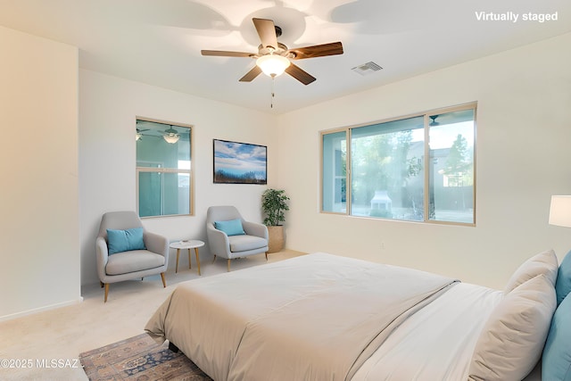 1091 E Empire Canyon Ln, Sahuarita, AZ 85629 - bedroom featuring ceiling fan, visible vents, baseboards, and light colored carpet