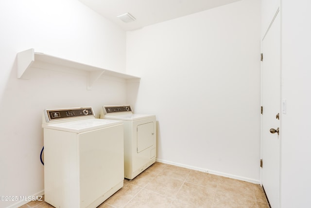1091 E Empire Canyon Ln, Sahuarita, AZ 85629 - laundry room featuring laundry area, light tile patterned flooring, washer and clothes dryer, and baseboards